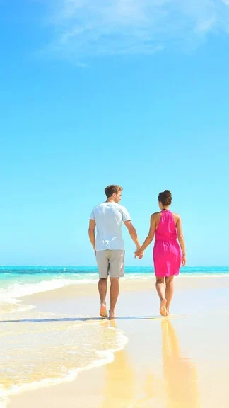Couples Walking on Sand Beach
